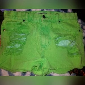 distressed neon green jean shorts